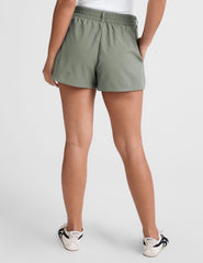 green shorts with an elastic waistband,  front zipper, button, and belt loops. 