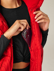 red button-up puffer vest with pockets.