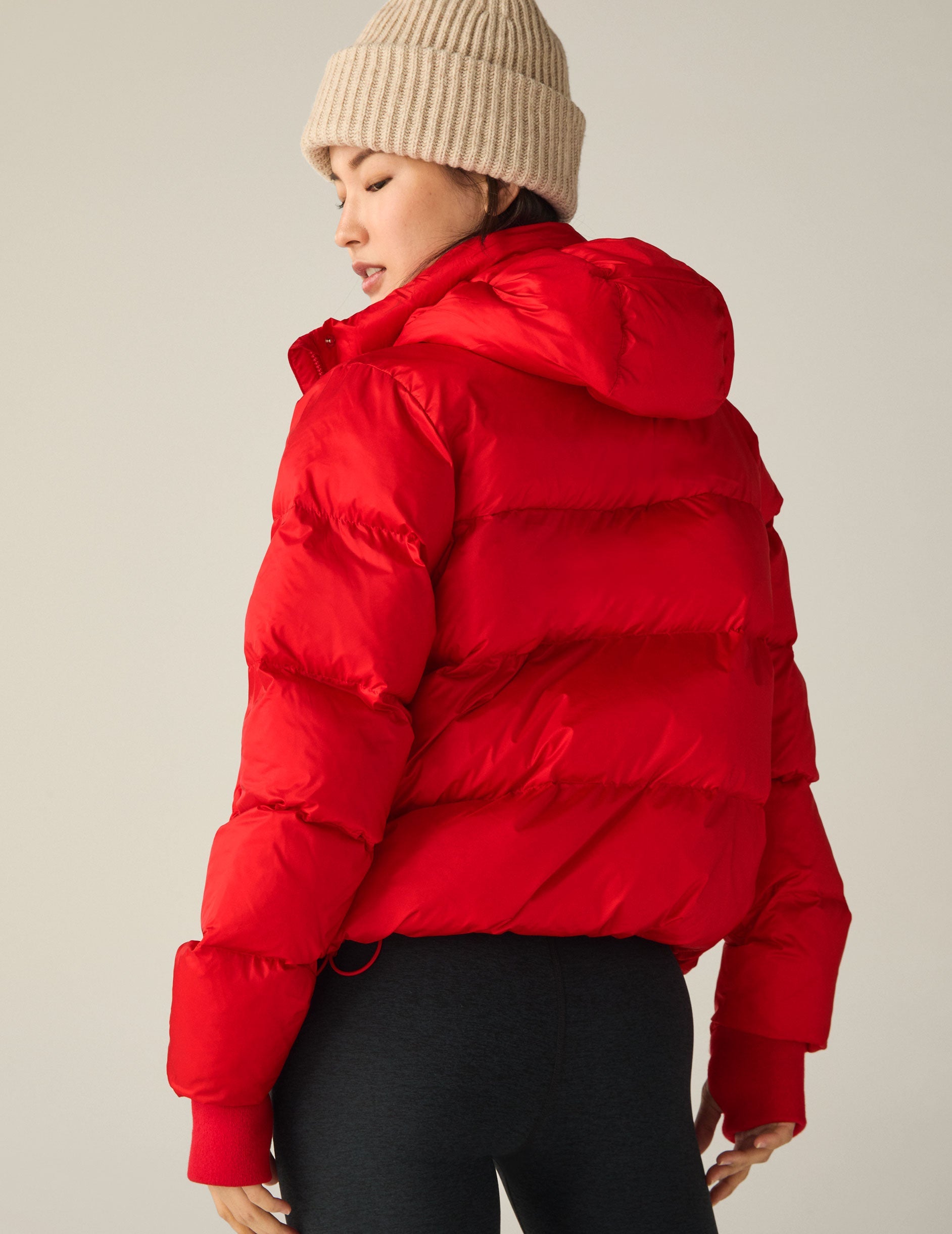 red hooded button & zip-up puffer jacket with pockets.