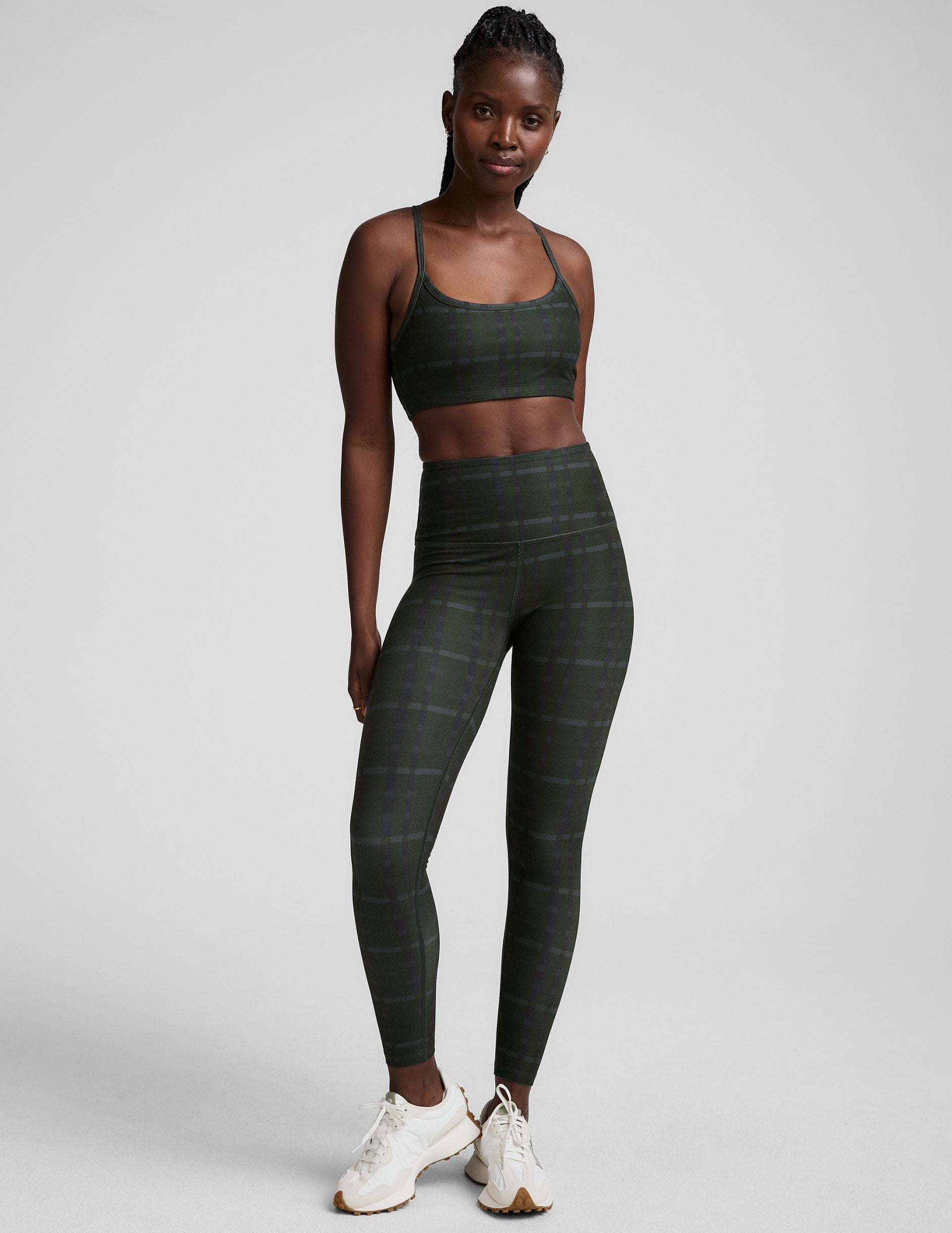 green plaid printed high-waisted midi length leggings.