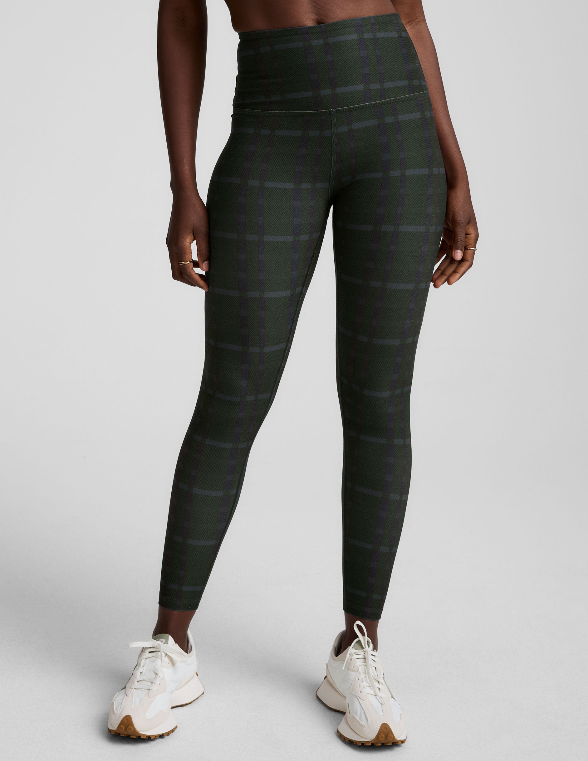 green plaid printed high-waisted midi length leggings.