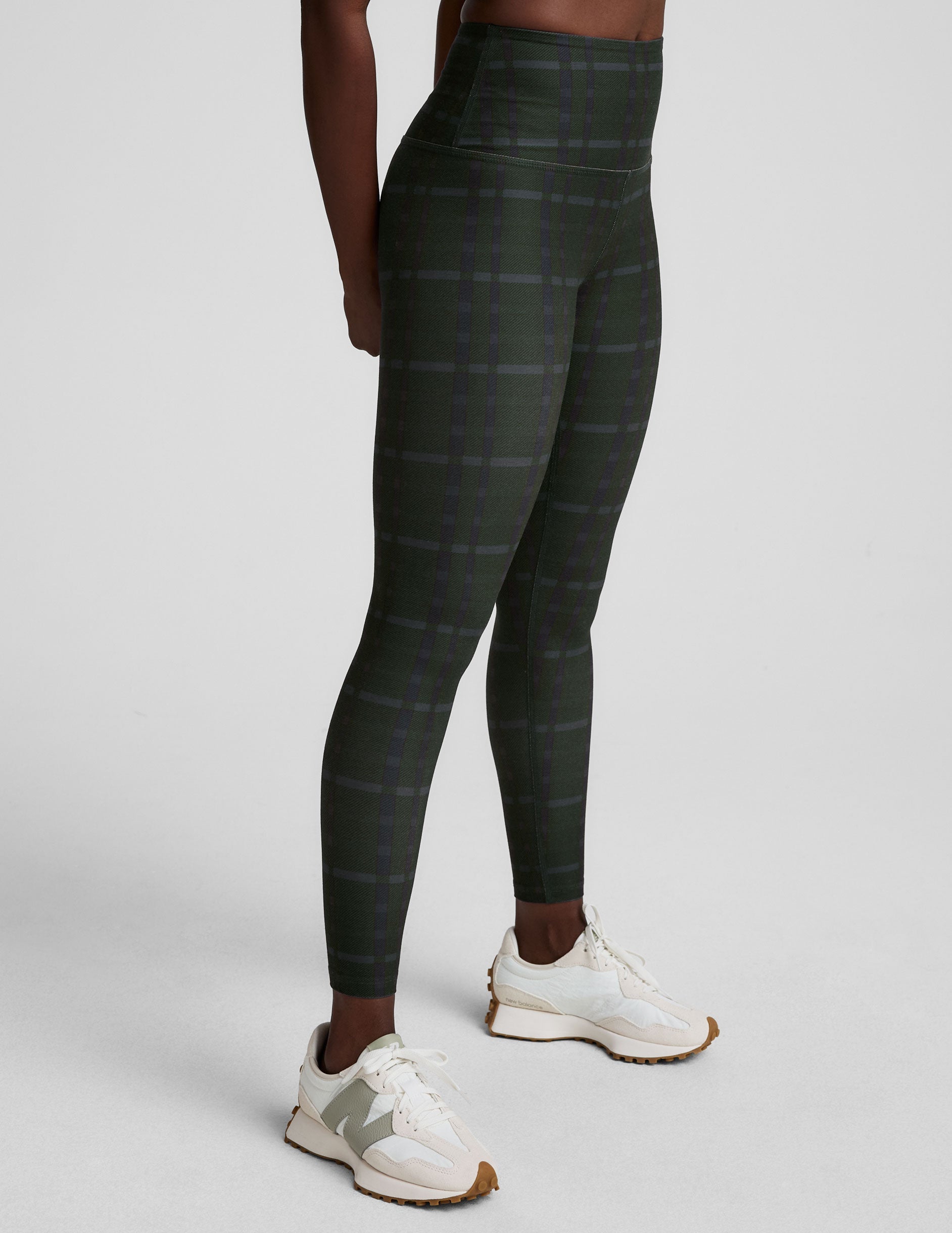 green plaid printed high-waisted midi length leggings.