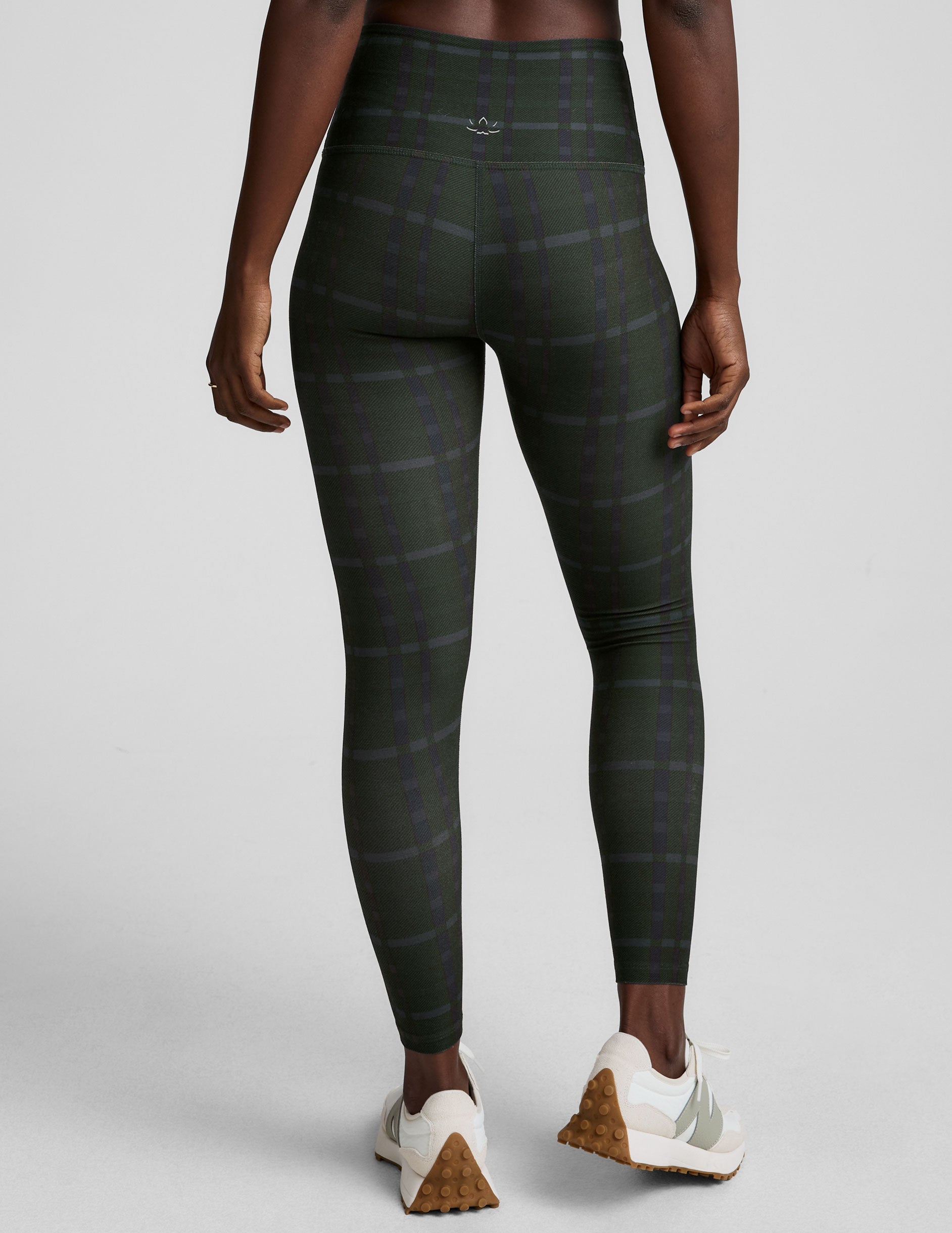 green plaid printed high-waisted midi length leggings.
