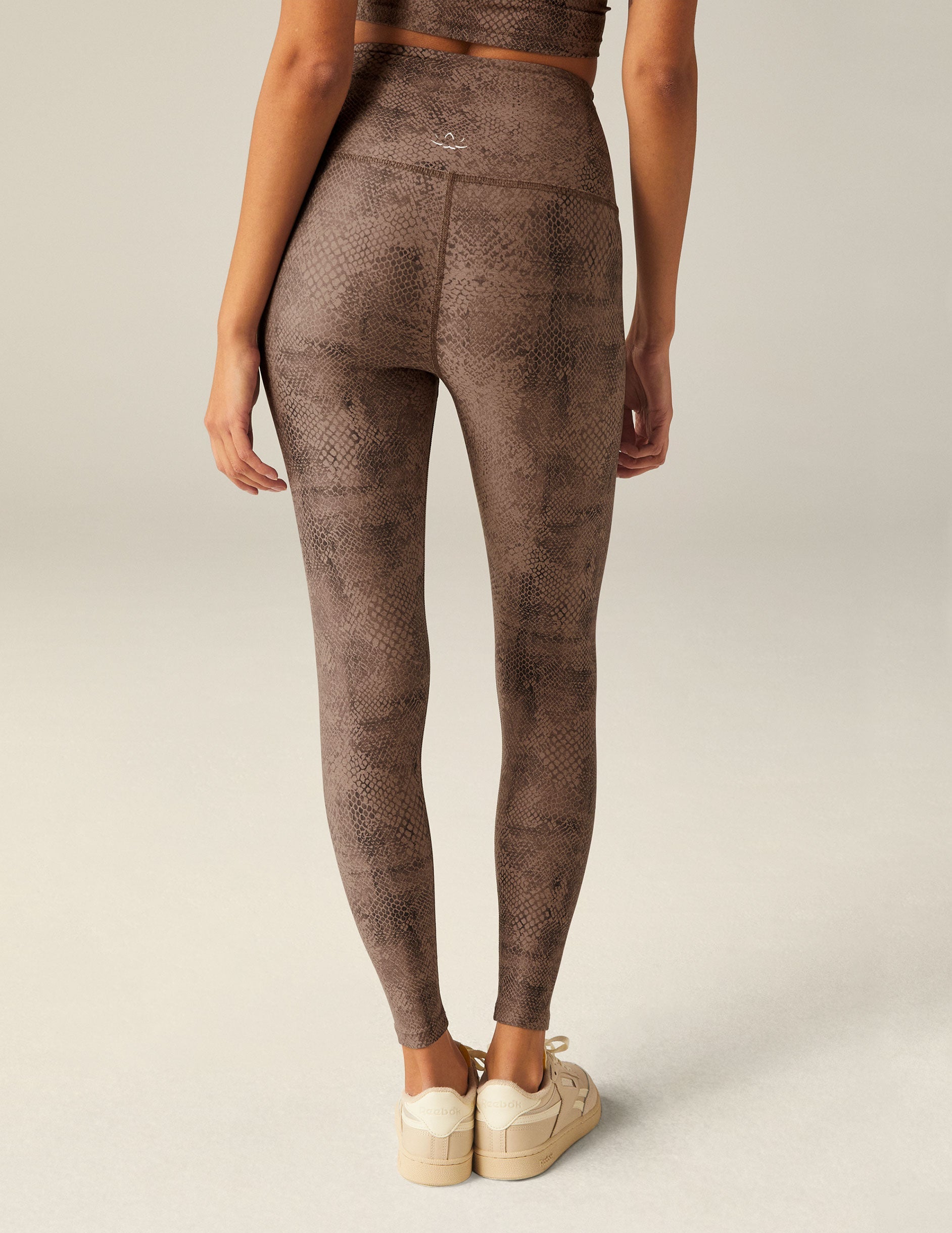 brown faux snakeskin printed high-waisted midi leggings.