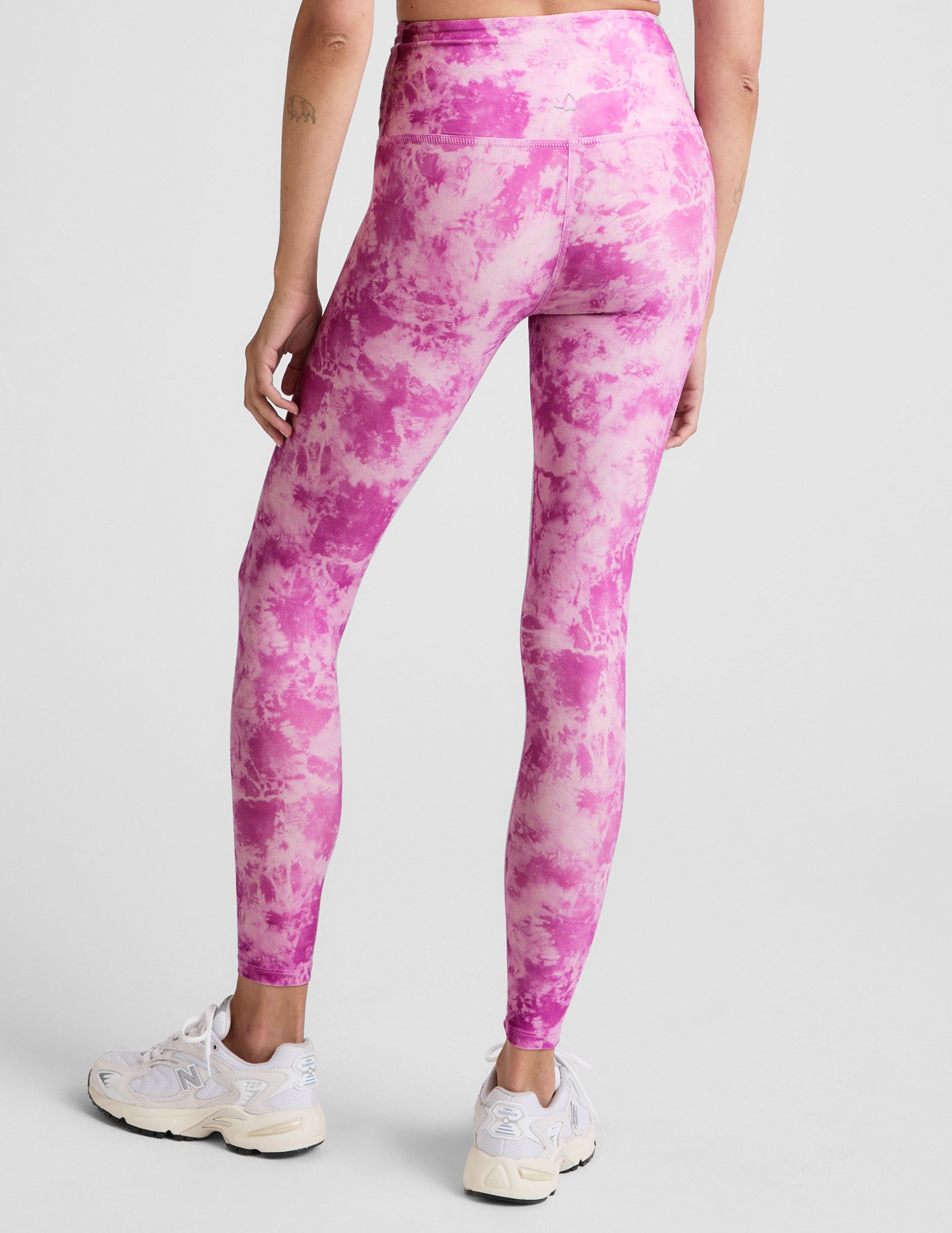 pink and white ice dye print high-waisted midi length leggings.