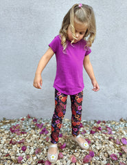 model is wearing toddler floral printed leggings.