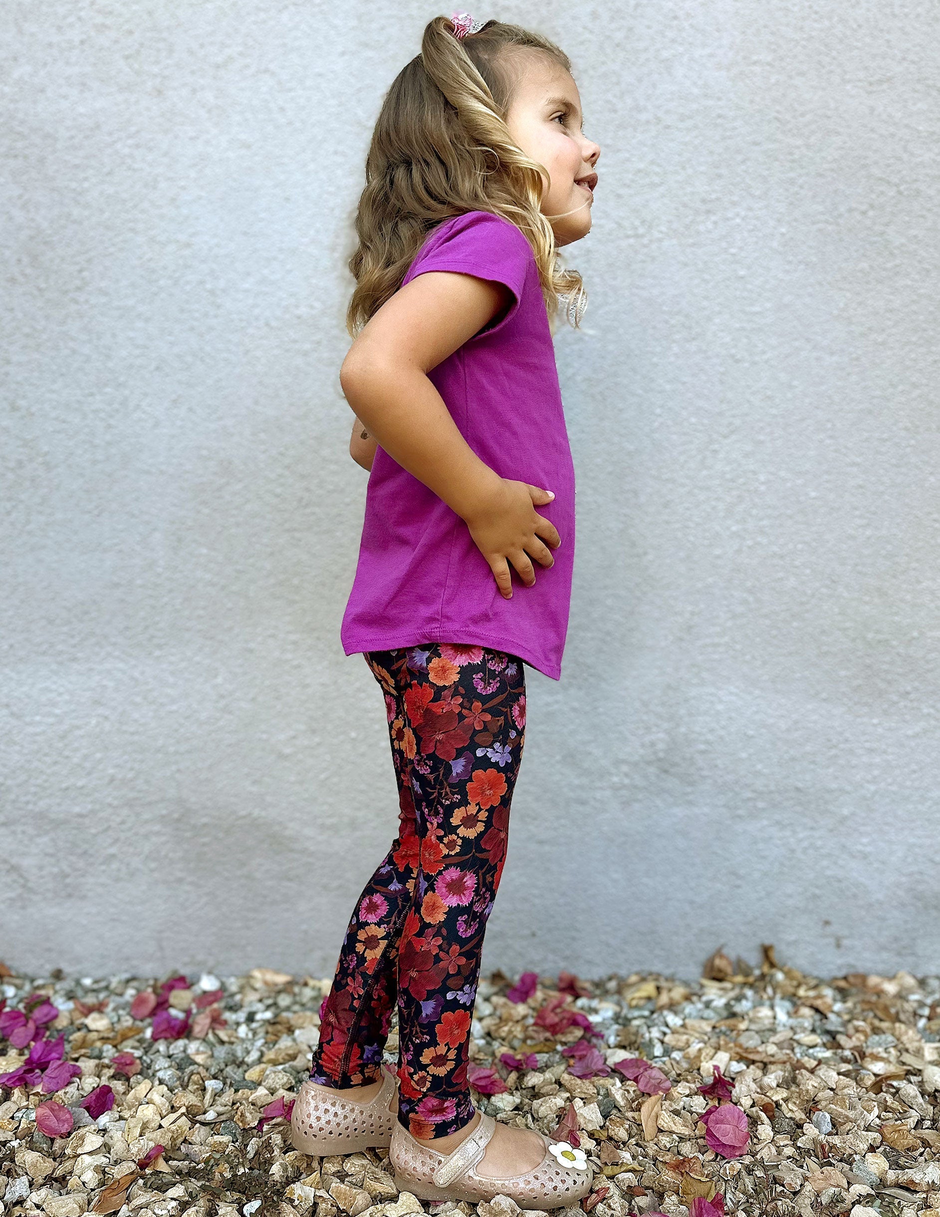 model is wearing toddler floral printed leggings.