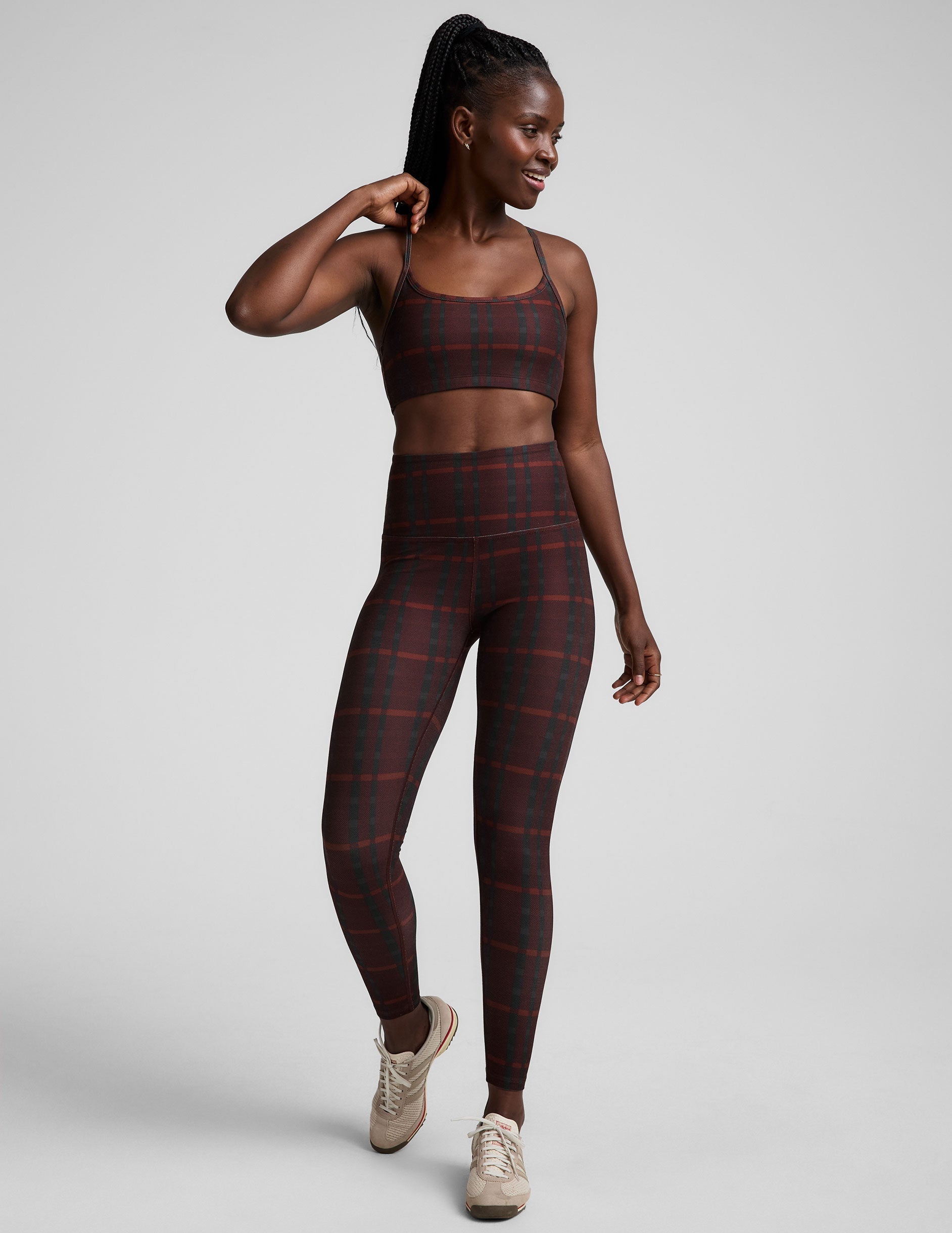 red racerback style bra with a plaid print and thin straps.