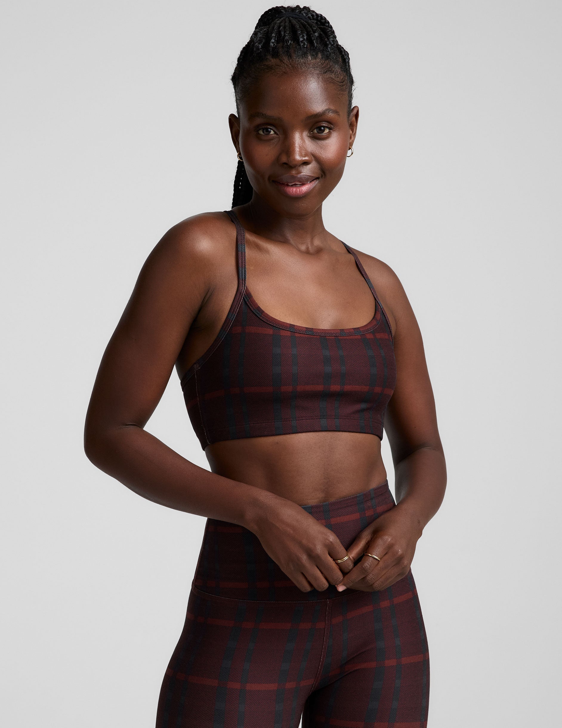 red racerback style bra with a plaid print and thin straps.