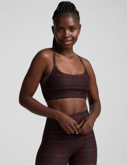 red racerback style bra with a plaid print and thin straps.