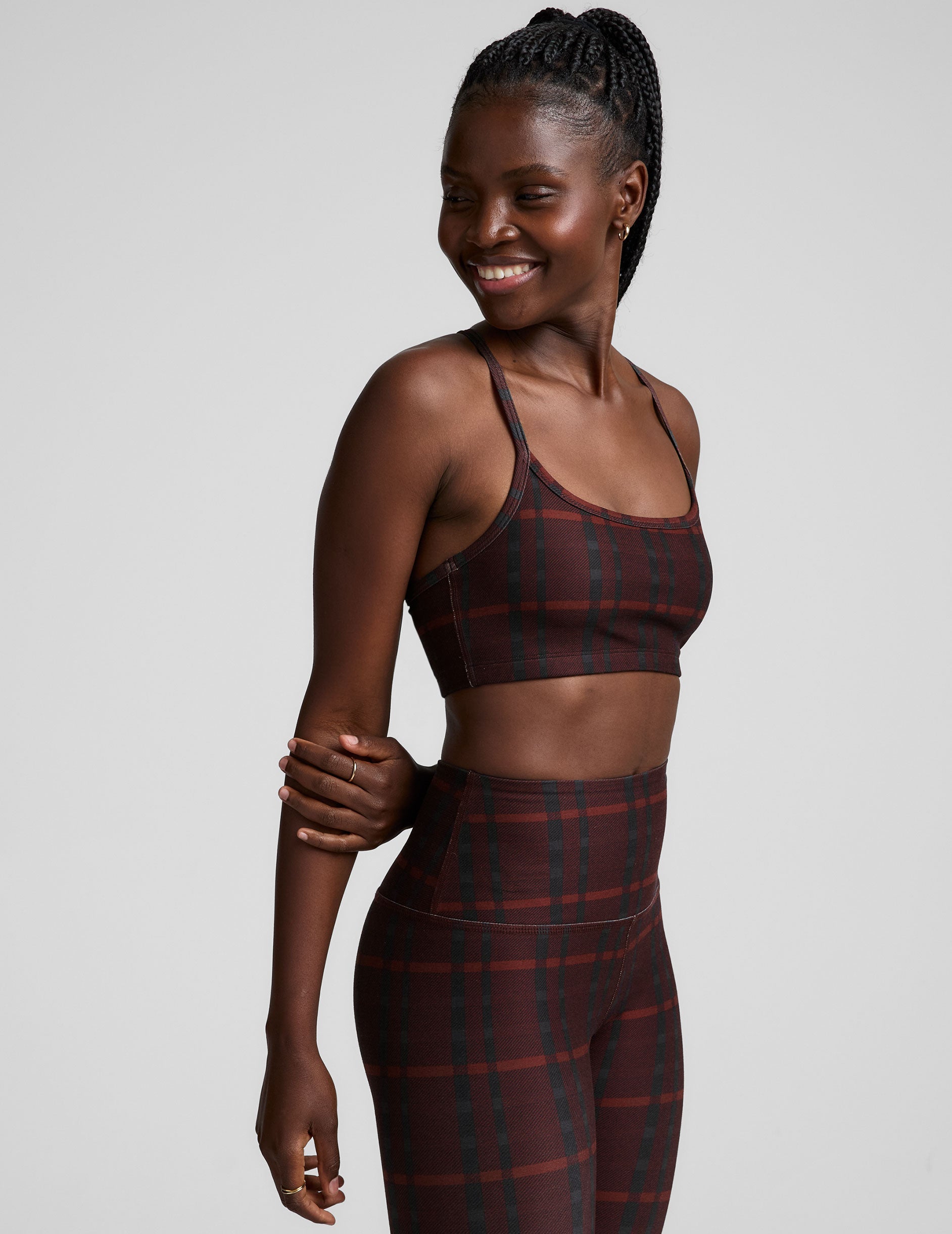 red racerback style bra with a plaid print and thin straps.