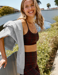 red racerback style bra with a plaid print and thin straps.