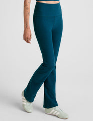 blue high-waisted bootcut pants.