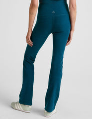 blue high-waisted bootcut pants.