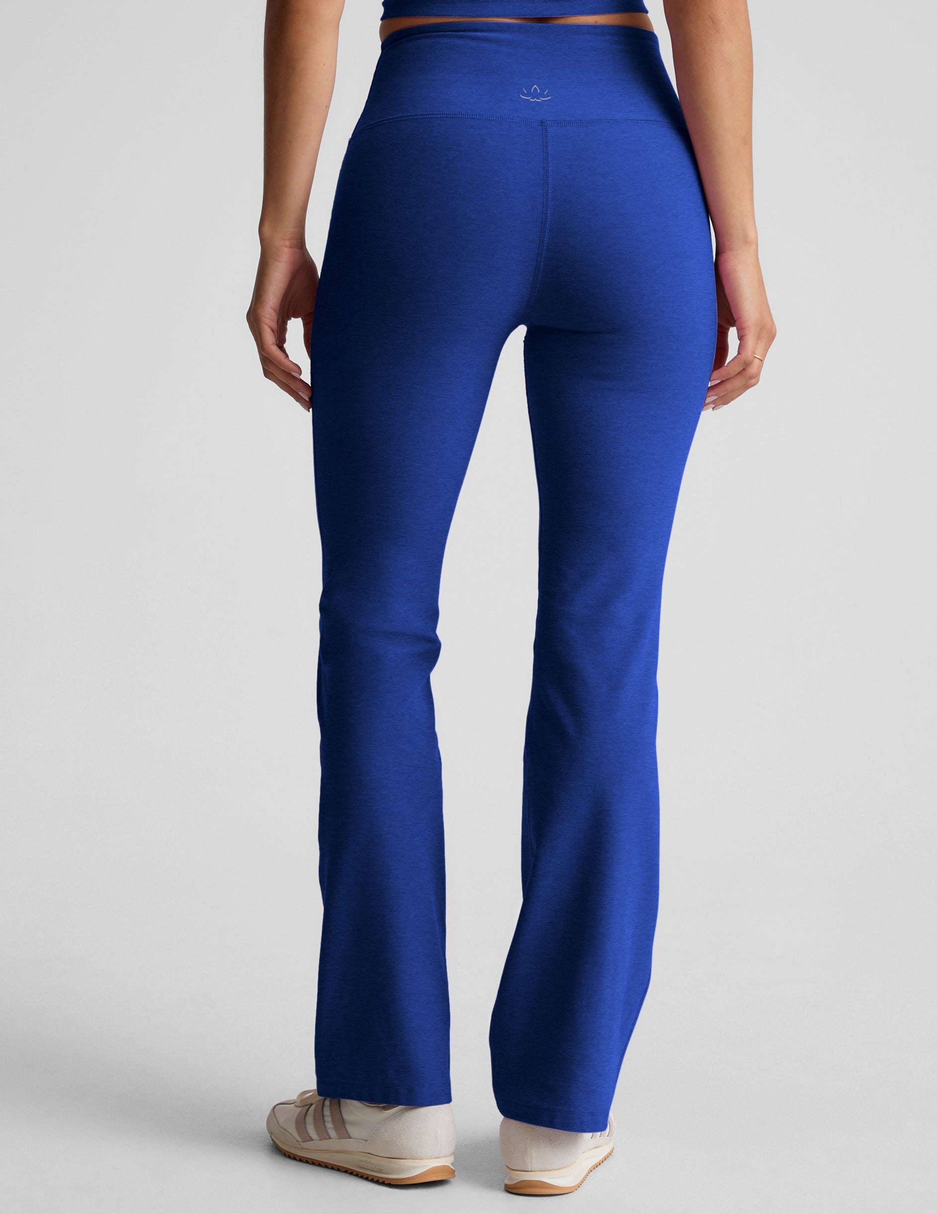 blue high-waisted bootcut pants.