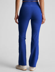 blue high-waisted bootcut pants.