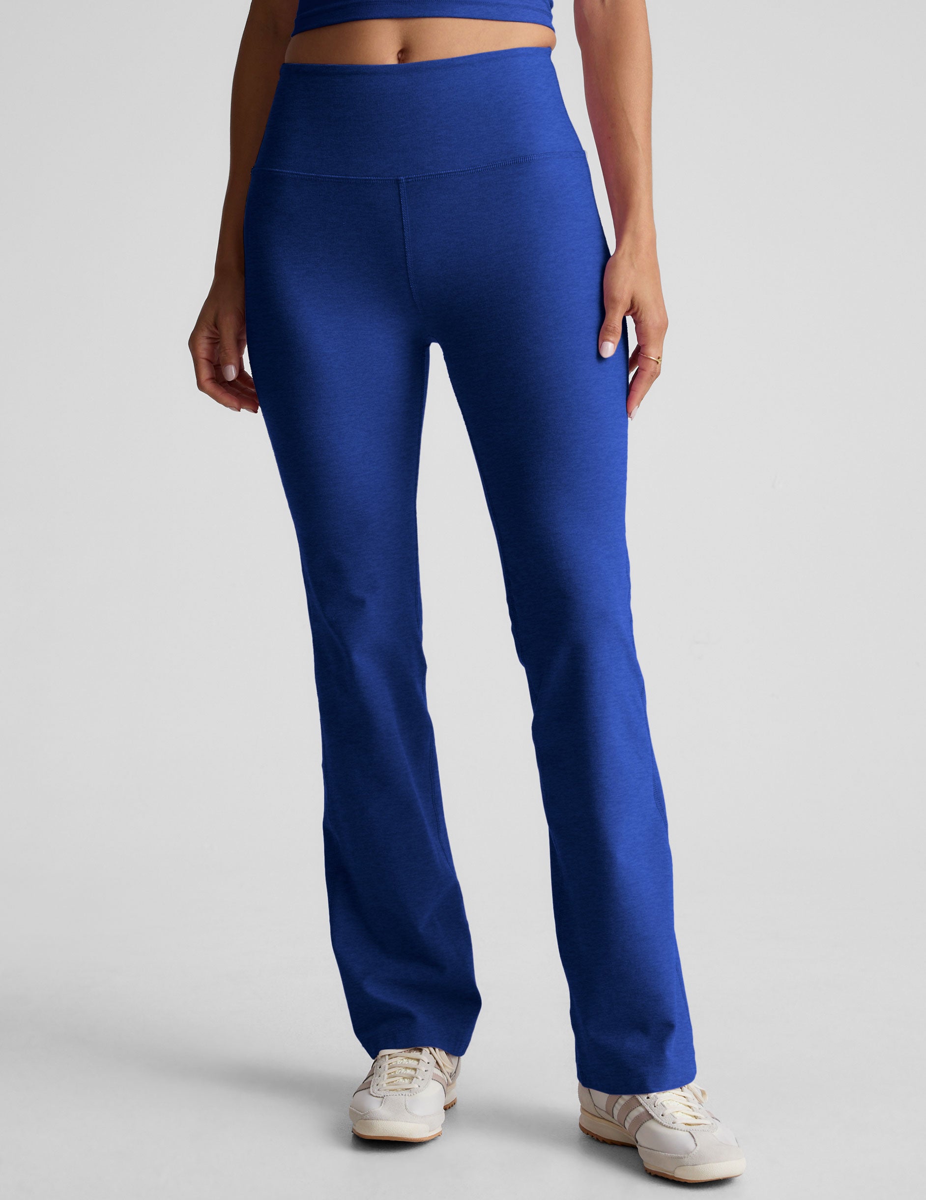 blue high-waisted bootcut pants.