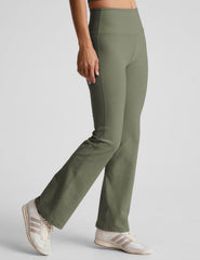 green high-waisted bootcut pants.