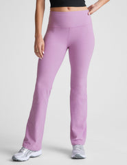 purple high-waisted bootcut pants.