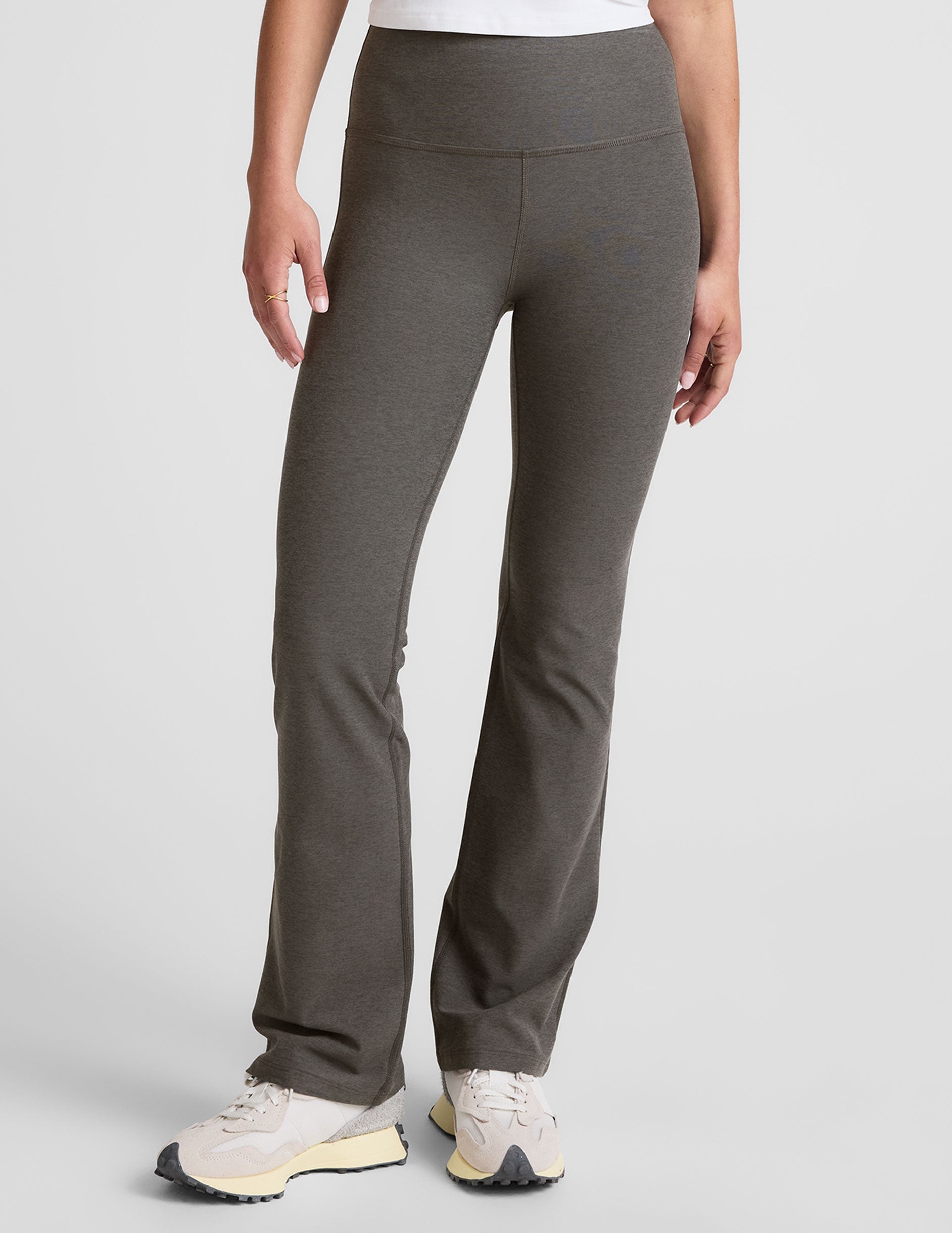 grey high-waisted bootcut pants.