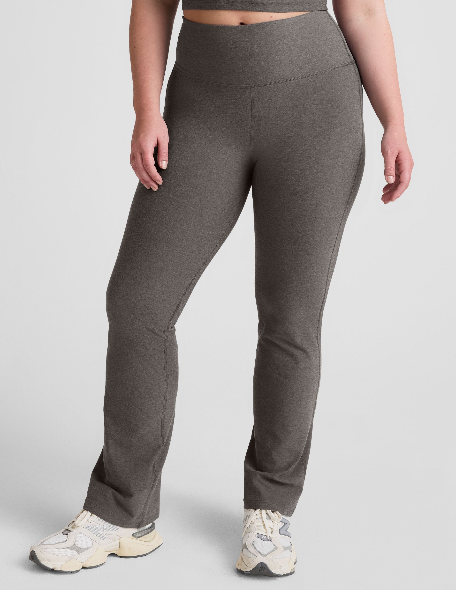 grey high-waisted bootcut pants.