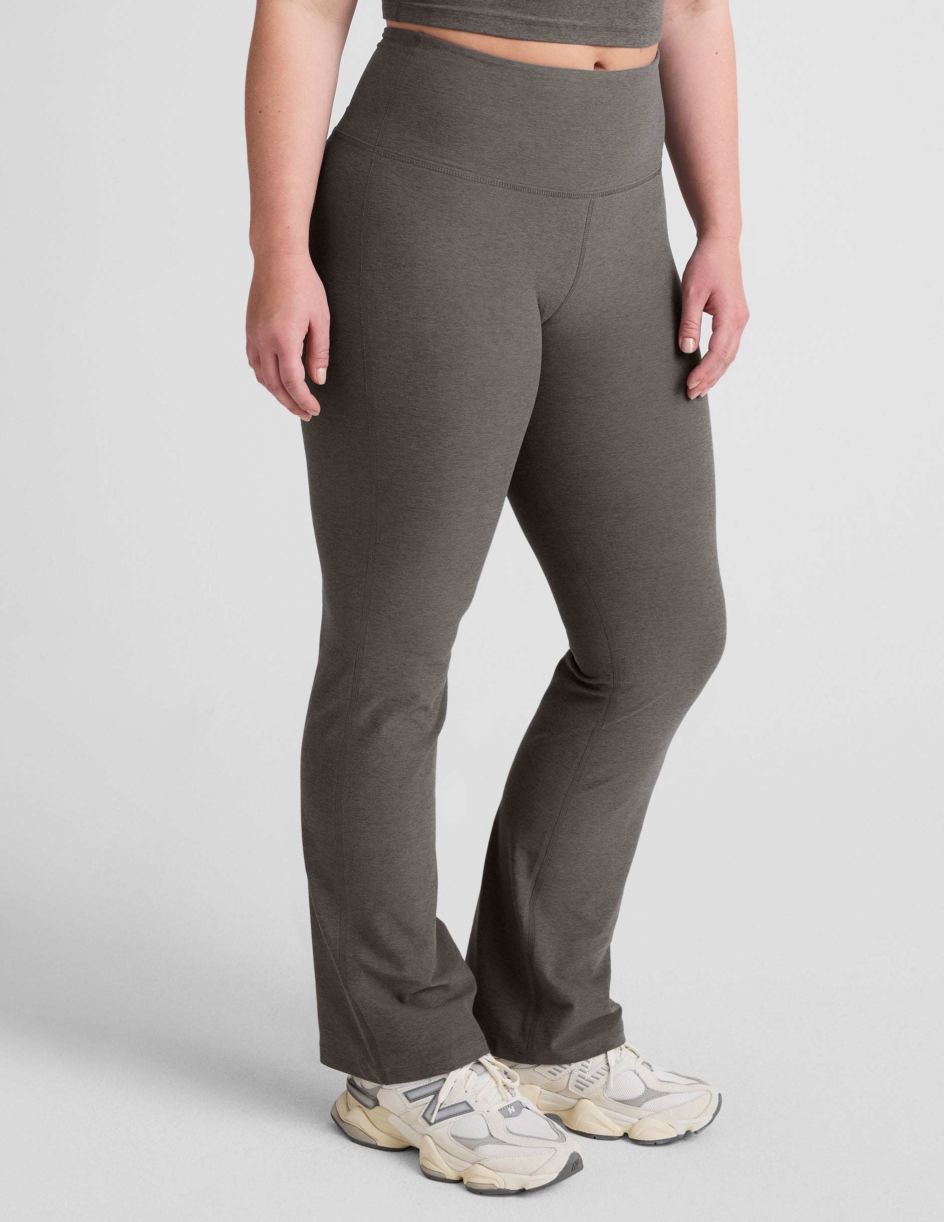 grey high-waisted bootcut pants.