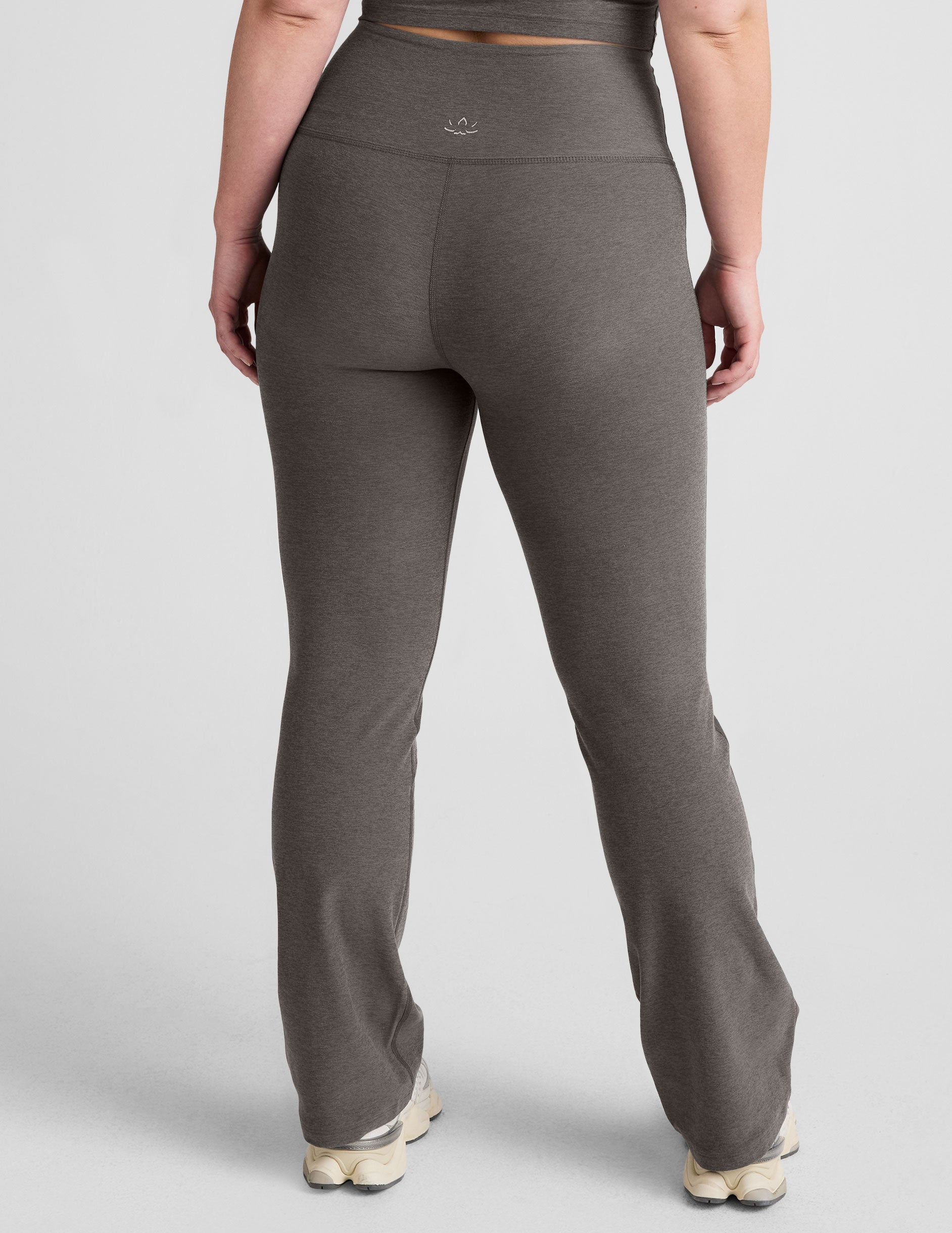 grey high-waisted bootcut pants.