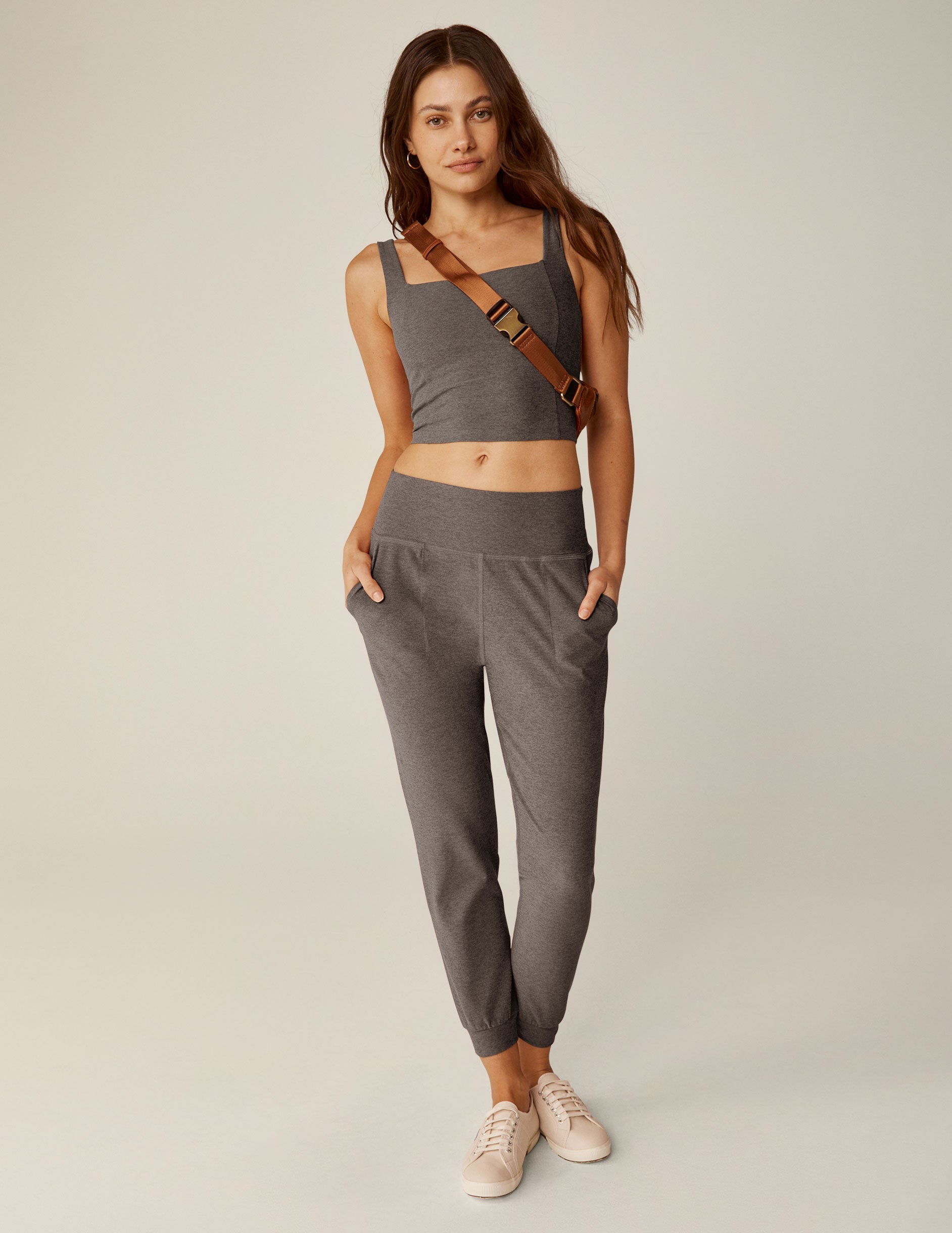 brown high-waisted midi length joggers with pockets.