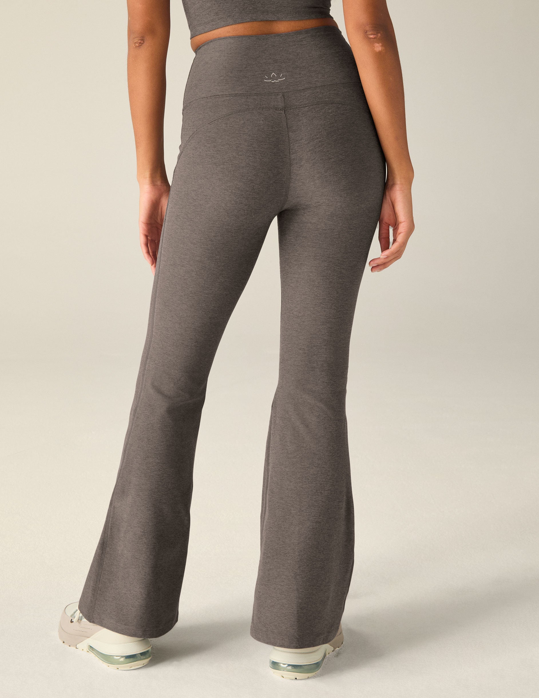 brown high-waisted flare pants with pockets.