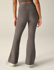 brown high-waisted flare pants with pockets.