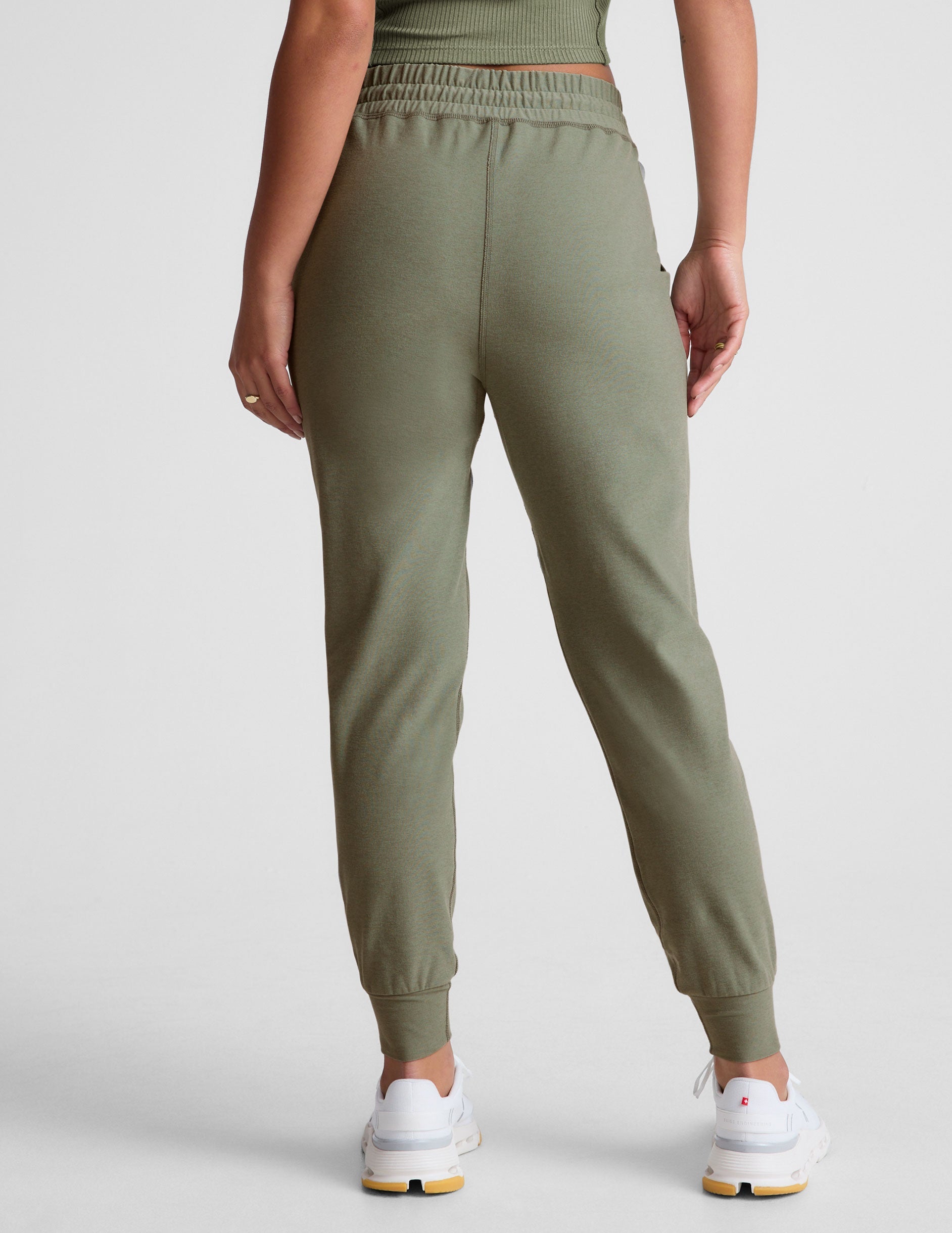 green midi length joggers with a drawstring in waistband and pockets.