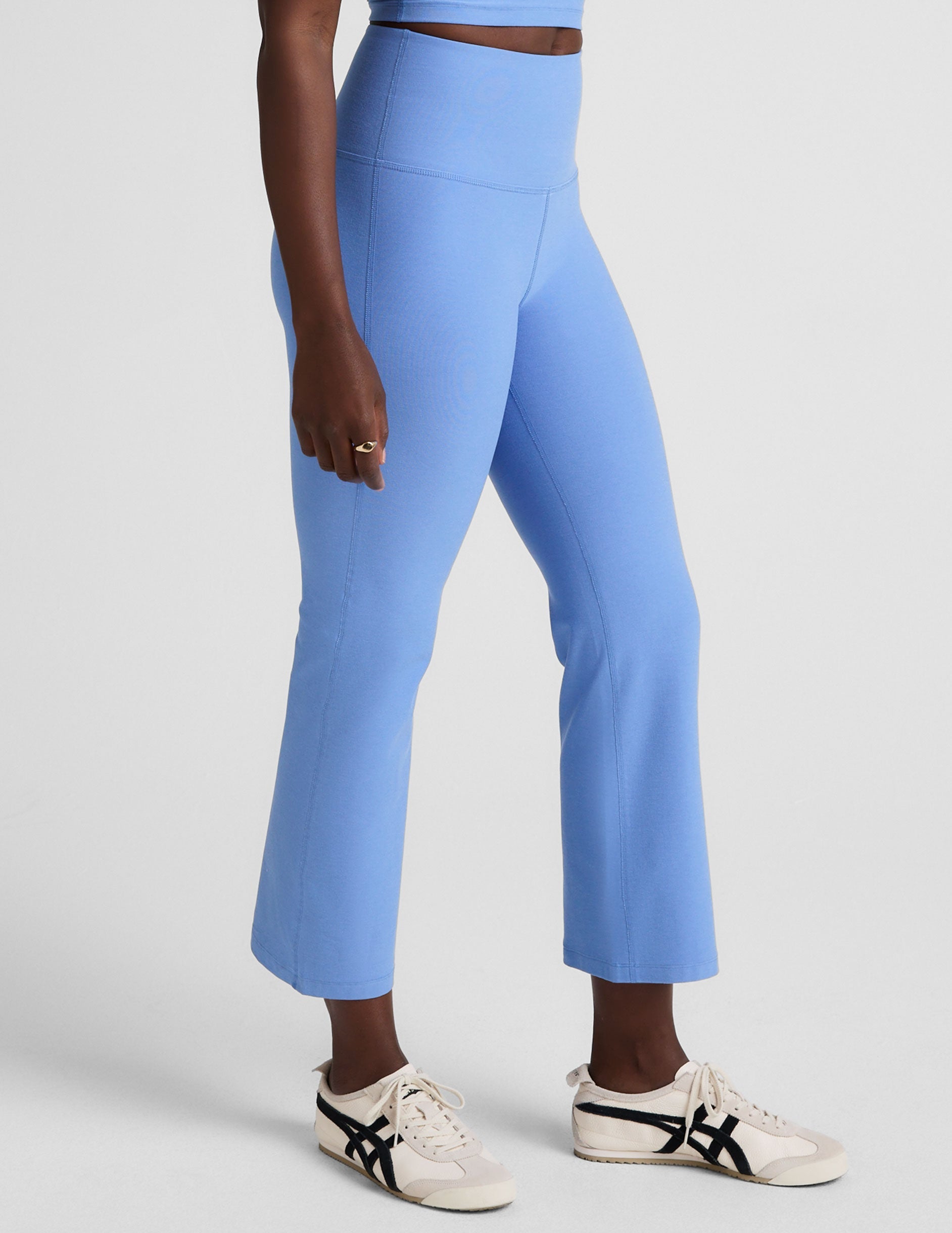 blue high-waisted cropped flare pants.