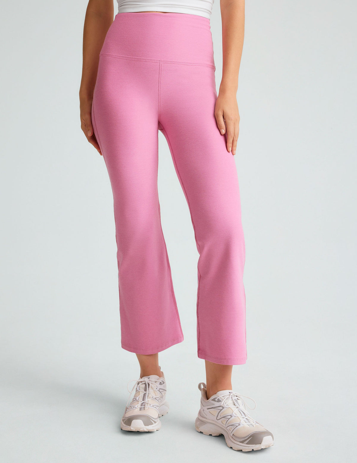 model is wearing pink high-waisted high-rise pants.