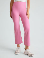 model is wearing pink high-waisted high-rise pants.