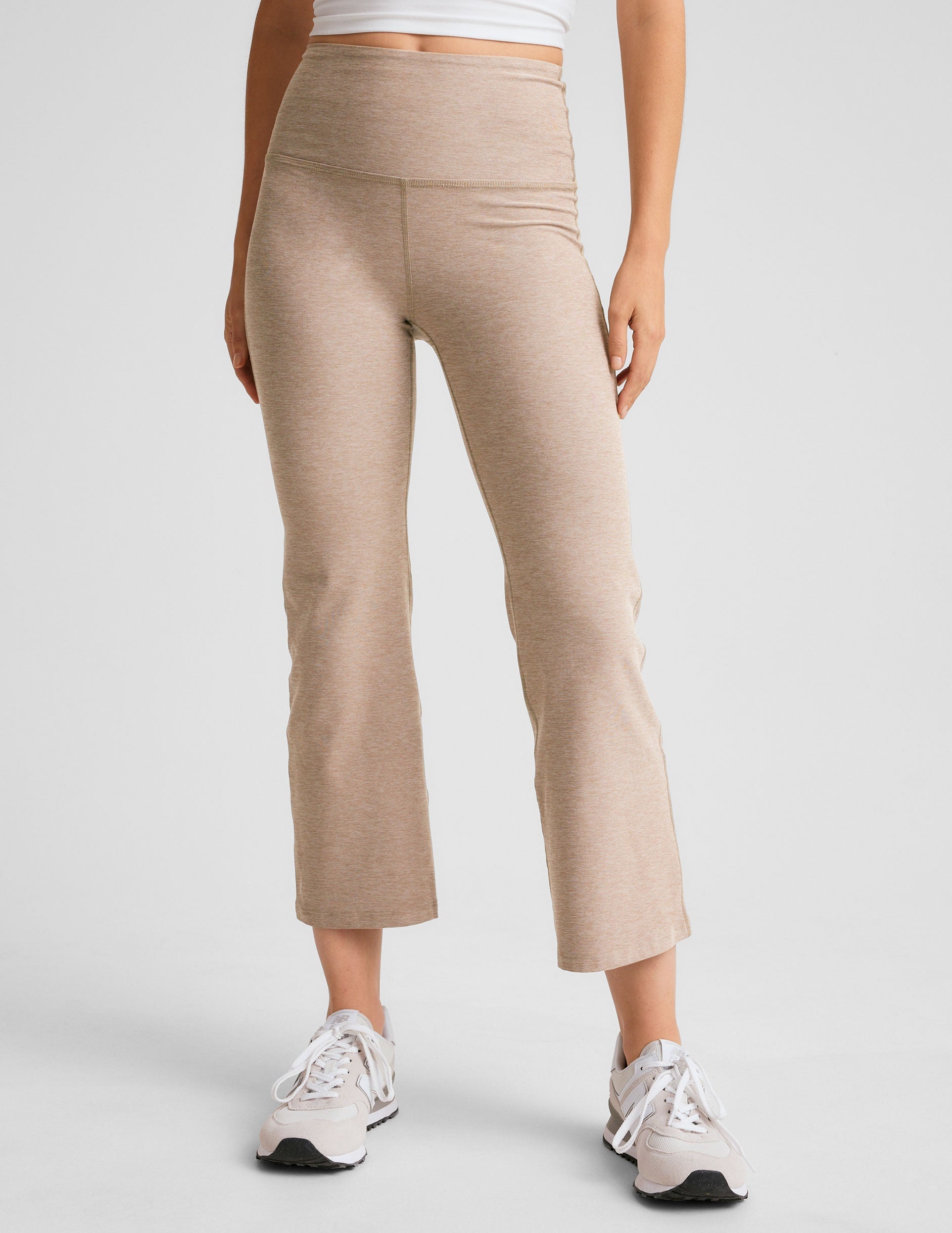 light brown high-waisted cropped flare pants.