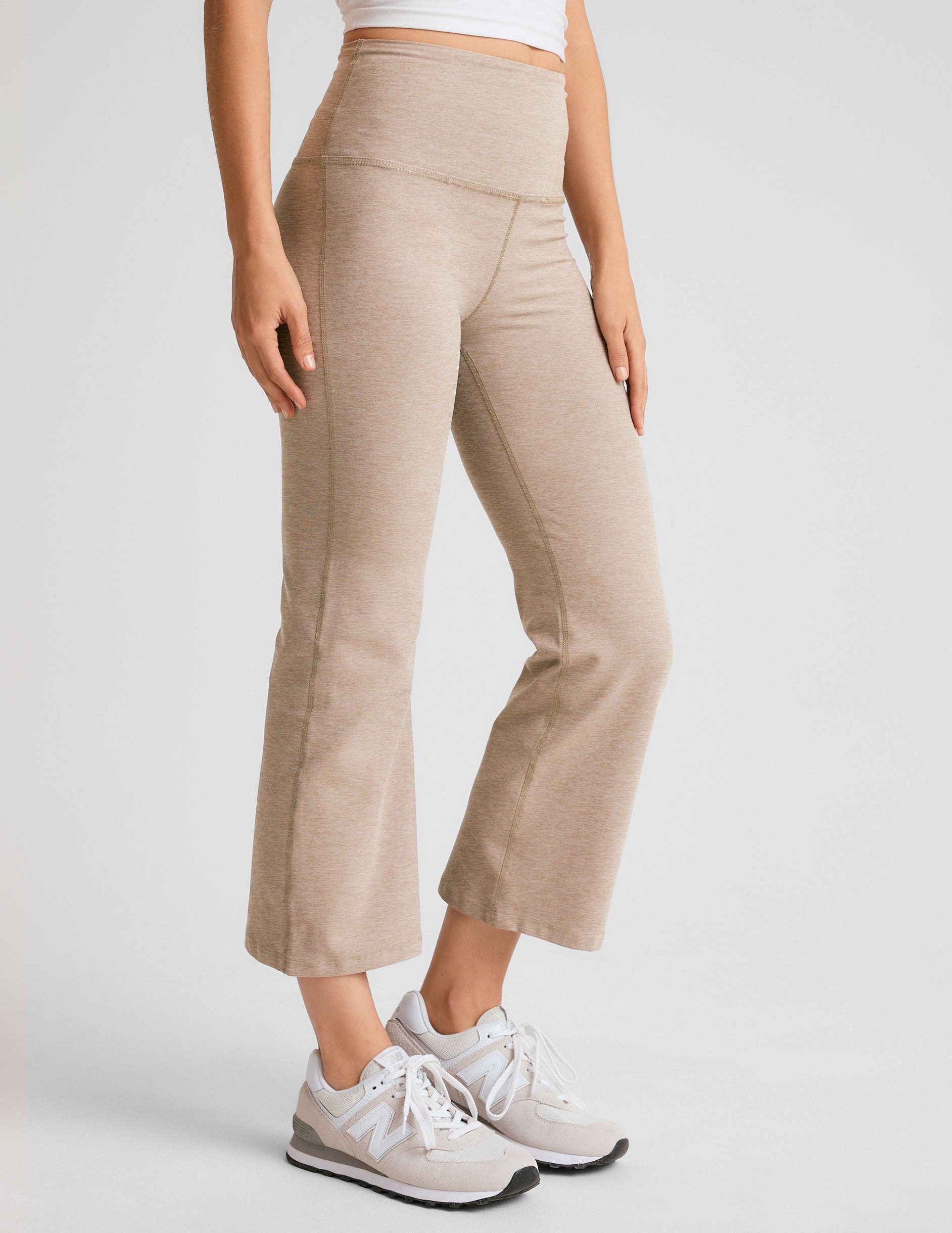 light brown high-waisted cropped flare pants.