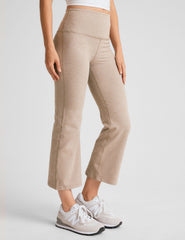 light brown high-waisted cropped flare pants.