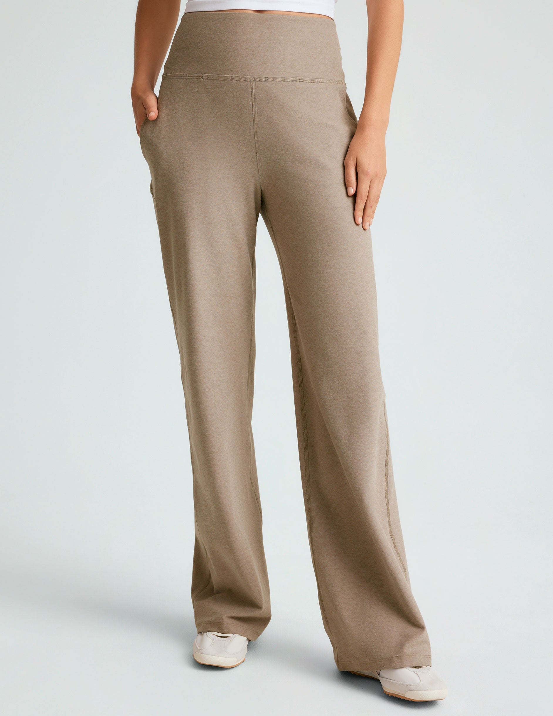 brown high-waisted short length pants with pockets.