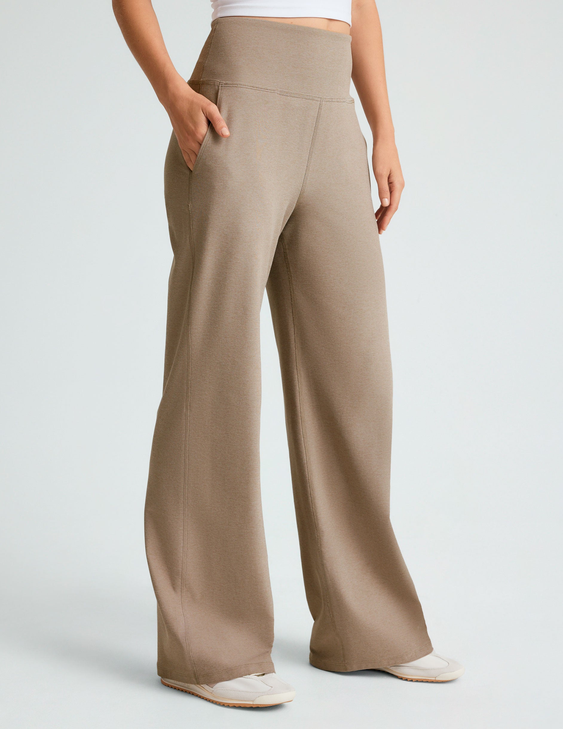 brown high-waisted short length pants with pockets.