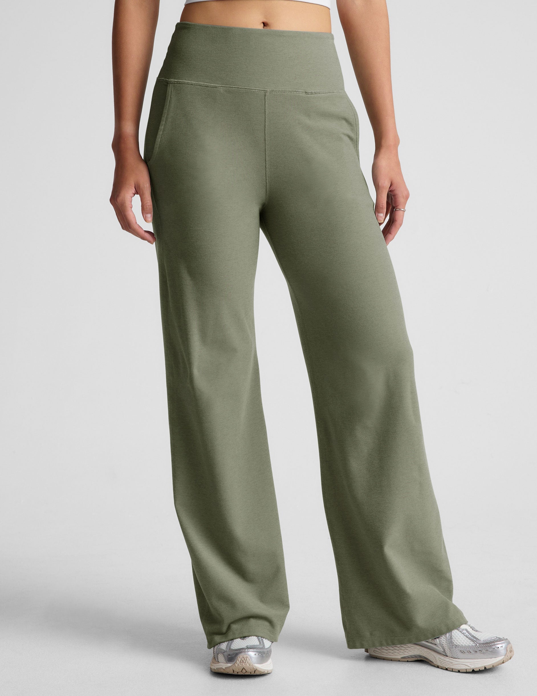 green high-waisted wide leg pants with pockets.