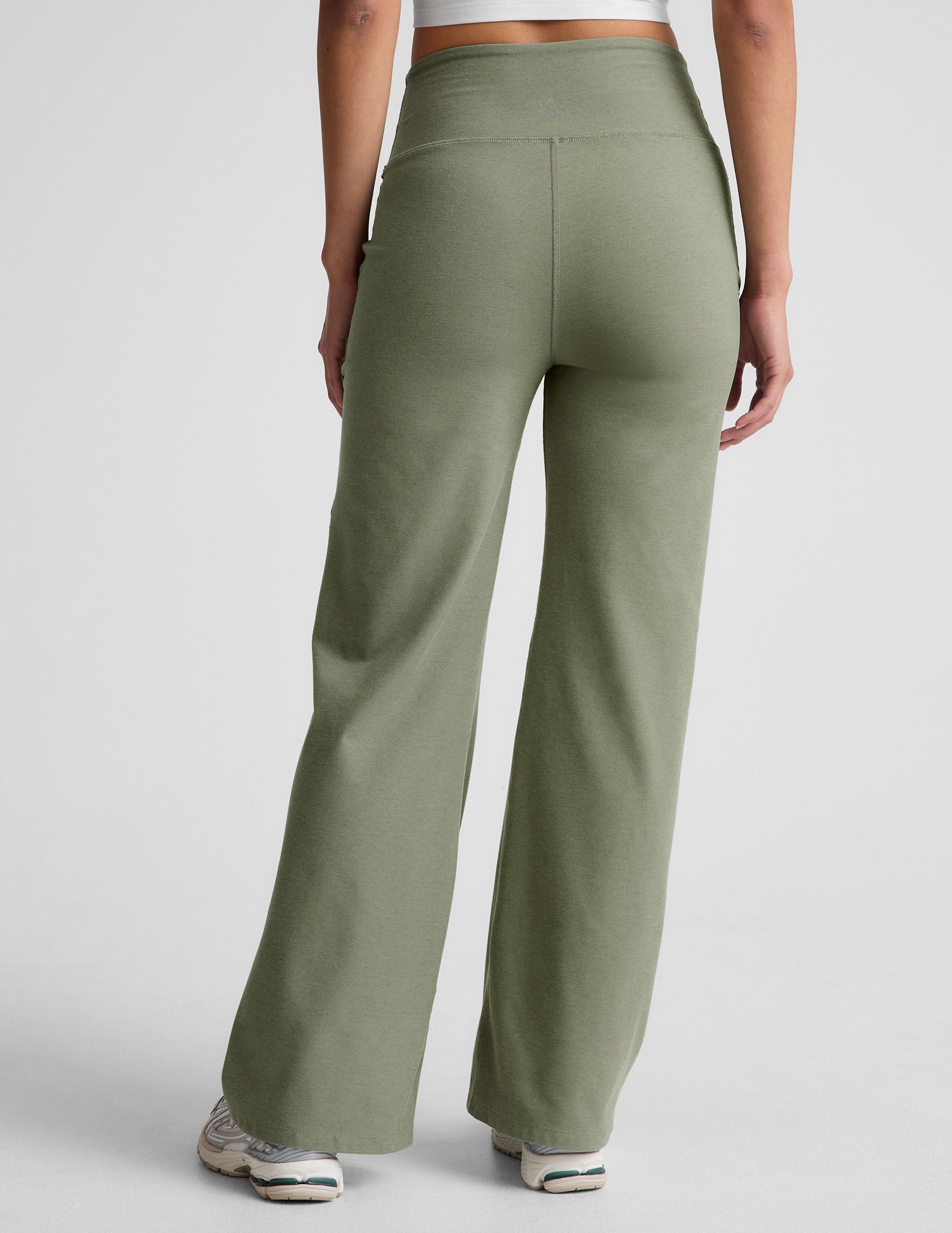 green high-waisted wide leg pants with pockets.