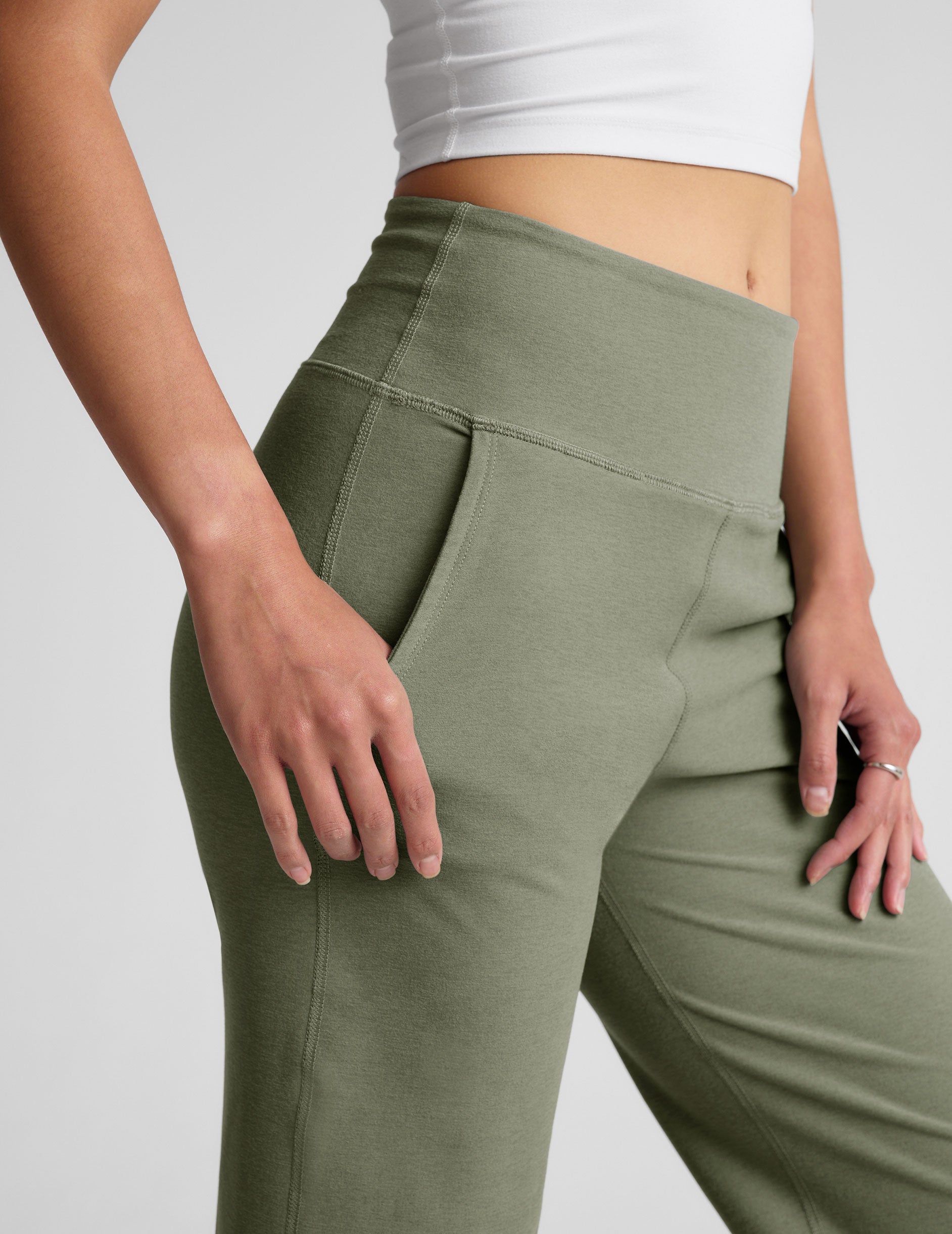 green high-waisted wide leg pants with pockets.