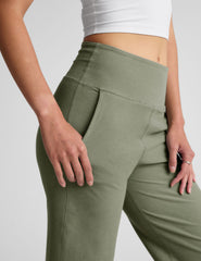 green high-waisted wide leg pants with pockets.