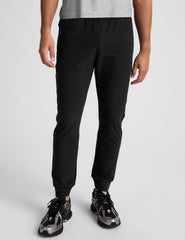 black jogger pants on a plain background.