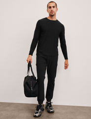 black jogger pants on a plain background.