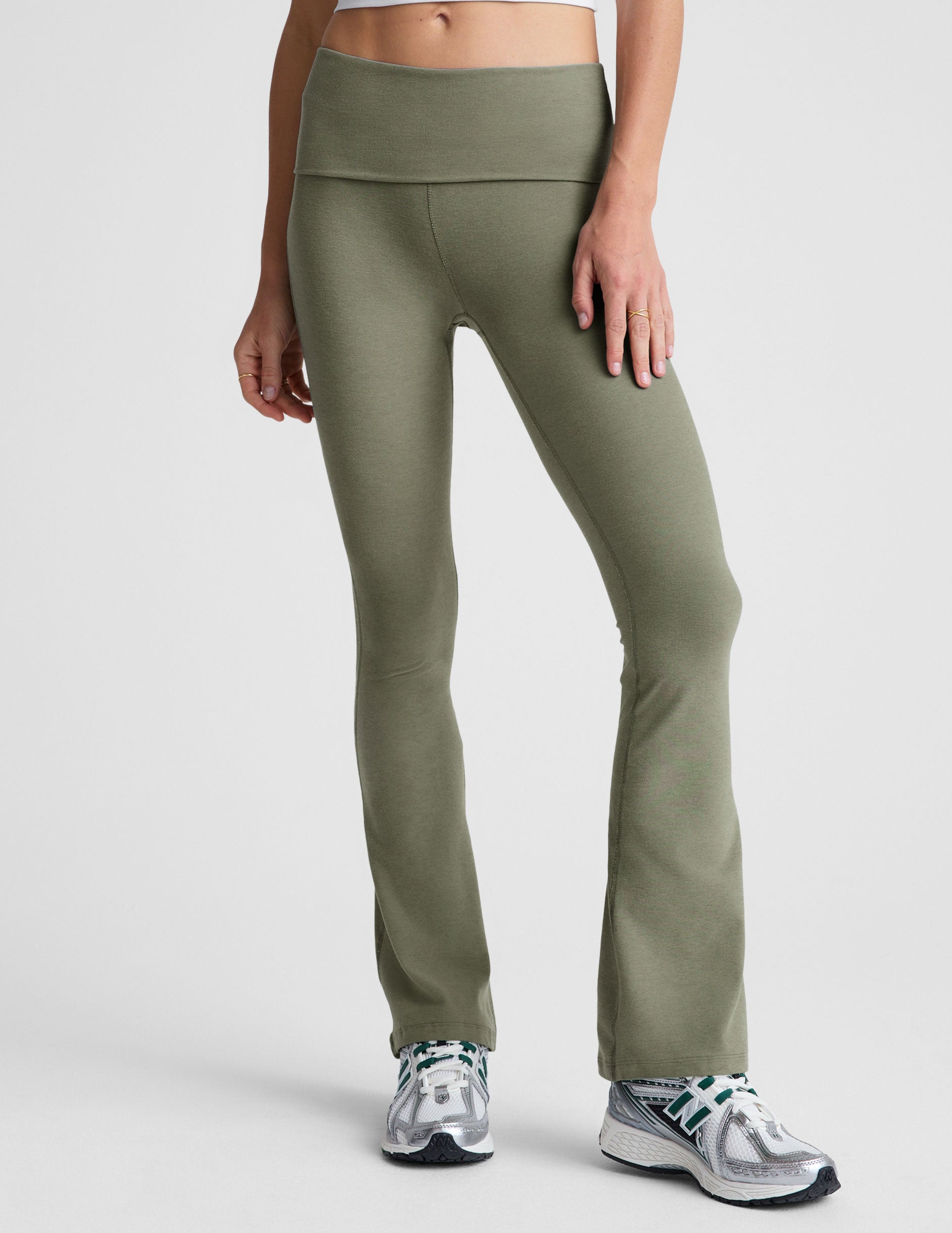 green bootcut pants with a foldover waistband.