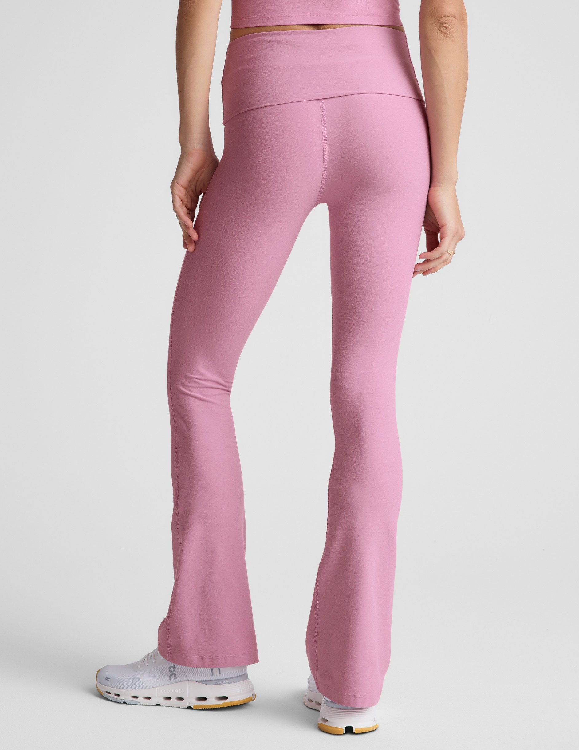 pink bootcut pants with a foldover waistband.