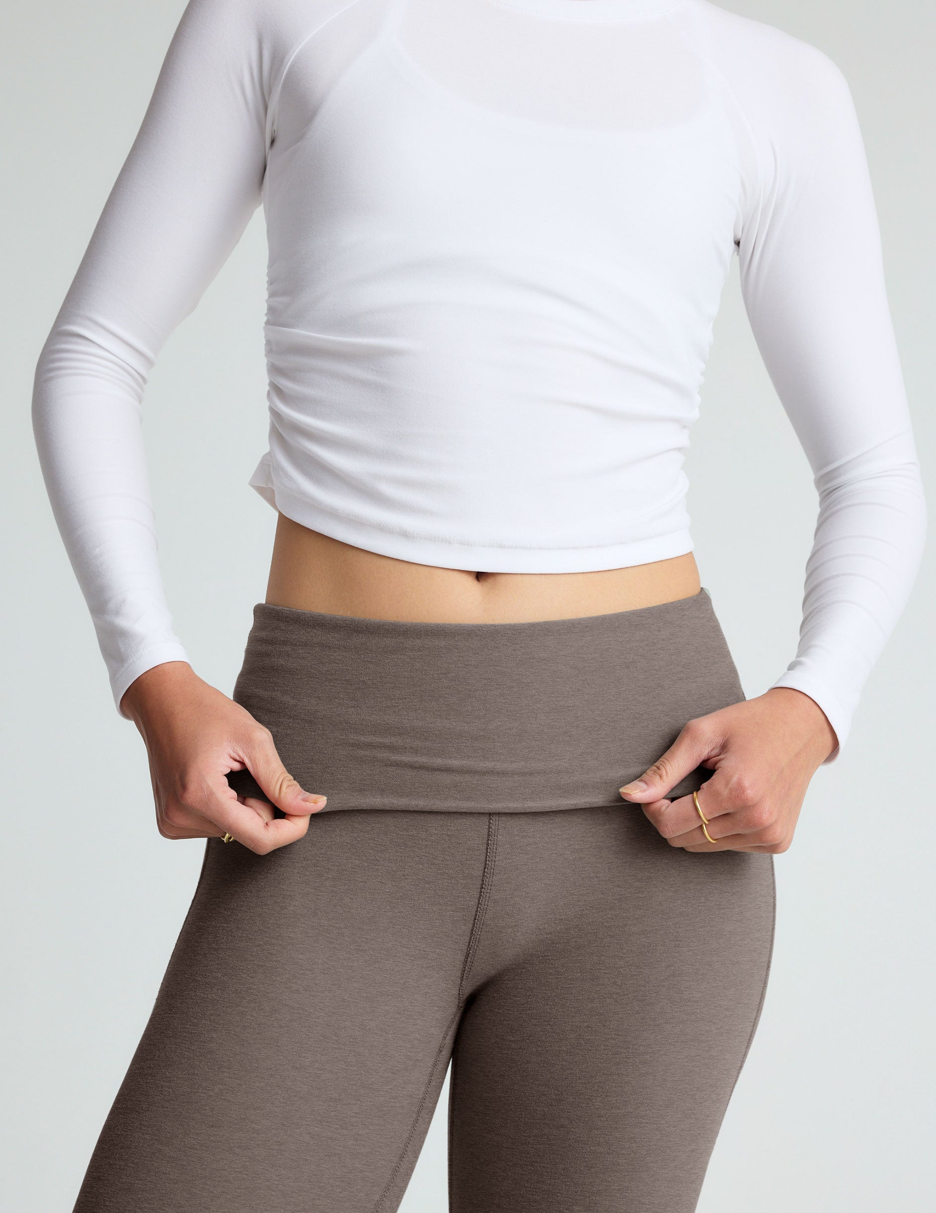 brown bootcut pants with a foldover waistband.