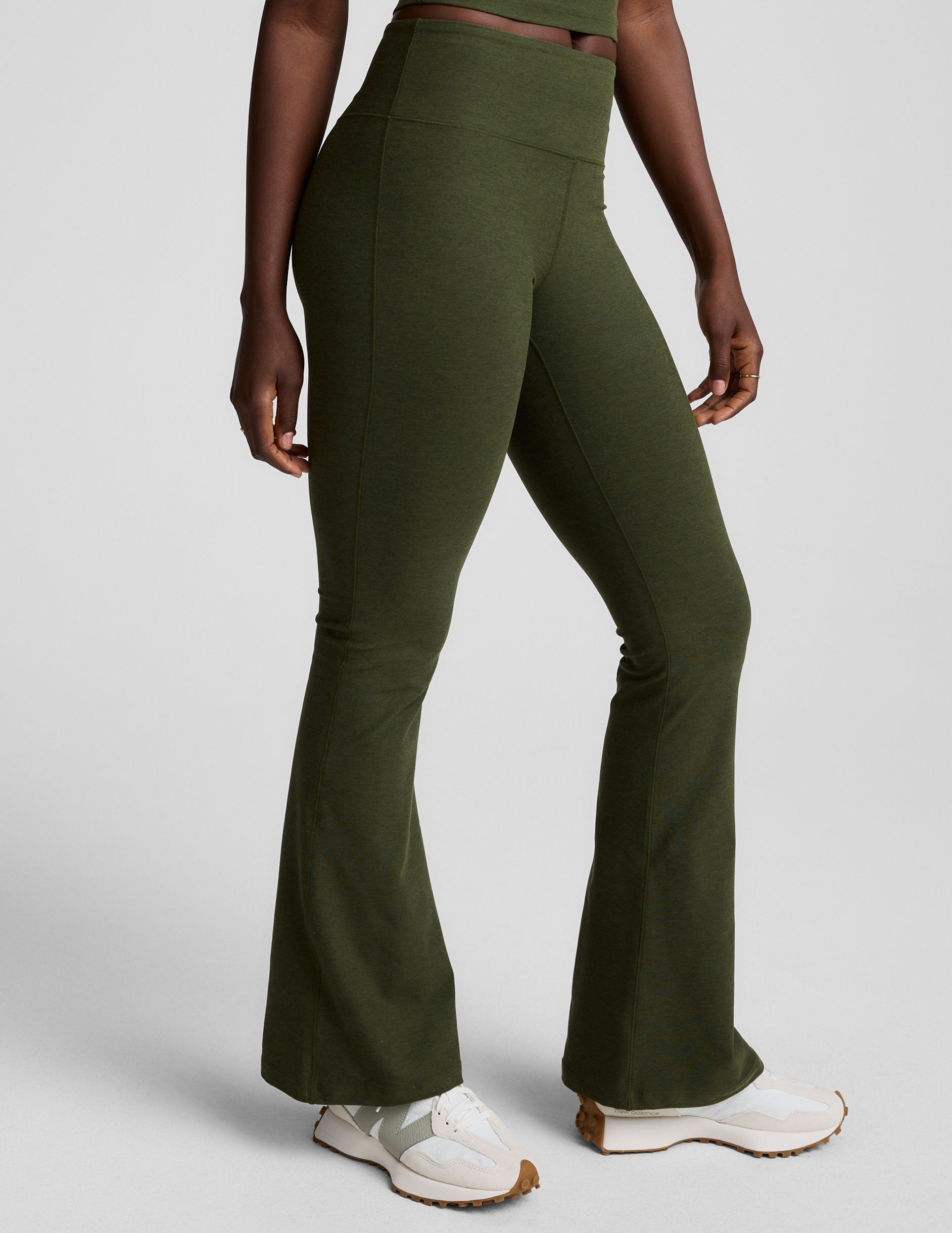 green mid-rise bootcut pants.