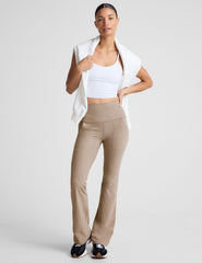 brown high-waisted bootcut pants with side pockets.